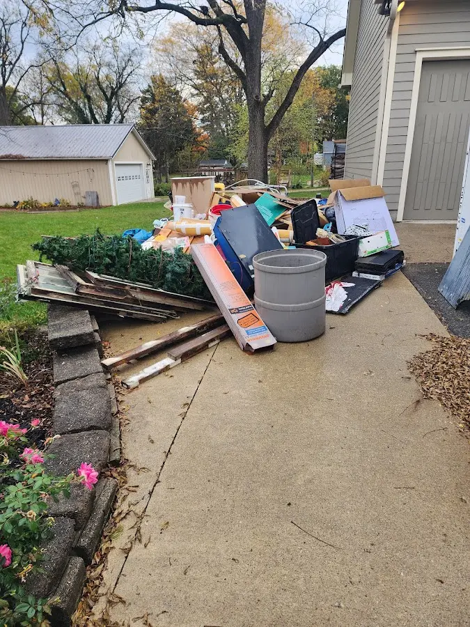 Dumpster being loaded with debris for Estate Cleanout Dumpster Rental in Orleans